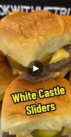 white castle sliders stacked on top of each other with cheese and pickle slices