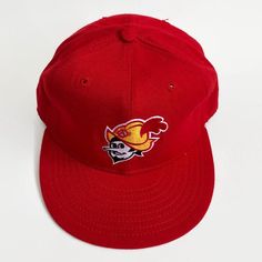 "In 1972, the Dukes joined the Pacific Coast League and became a Triple A team. Future Dodgers manager Tommy Lasorda managed the 1972 team that amassed a 92-58 and won the PCL championship. Offered here is an original game issued 1980s Albuquerque Dukes cap. This vintage fitted from New Era is a must-have for any longtime Dukes fan. The cap features the Dukes mascot embroidered on the front center. The six-point crown suspension's interior is lined with a leather sweatband that is home to a vint Minor League Baseball, Vintage Fits, Pacific Coast, Classic Leather, Hat Sizes, Fitted Hats, Trucker Cap, New Era, A Team