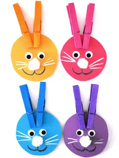 four colorful paper bunny and cat tags on a white background with text overlay that says easter crafts for kids