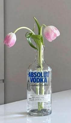 there is a bottle with some flowers in it