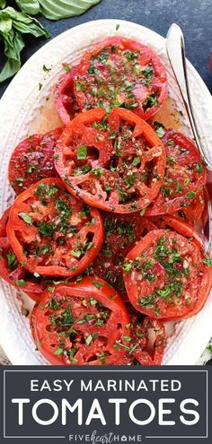 an easy marinated tomato recipe on a white plate with text overlay that reads, easy marinated tomatoes