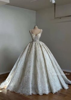 a wedding dress on display in a room