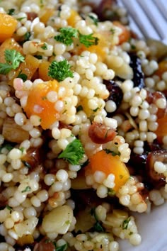 a white plate topped with corn and vegetables