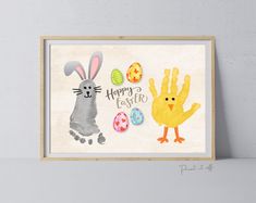 an easter card with the words happy easter and two rabbits holding painted eggs in front of them