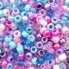 many different colored beads are grouped together