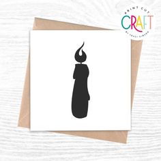 a black and white card with the silhouette of a candle on it's side