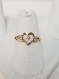 "Thanks for shopping our vintage estate store. We tend to sell well below wholesale and truly hope you enjoy all of our items. Many of the items are one of a kind, so please enjoy scrolling through the pictures and hopefully something will catch your eye. Brown spots are from camera. Estate 10k yellow gold .04ct cz diamond heart ring. Ring size: 6.75 CZ Diamond: .04ct Setting: 8mm 3/8\" Band width: 1mm Weight: 1.01 grams Very sweet ring. Marked 10k." Vintage Gold Heart Ring With Birthstone, Real Gold Rings, Custom Gold Jewelry, Xoxo Jewelry, Dope Jewelry Accessories, Sweet Ring, Diamond Heart Ring, Baby Baptism, Gold Rings Fashion