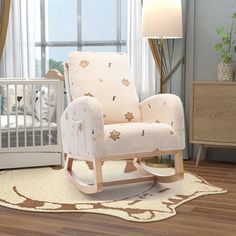 a baby's room with a rocking chair and crib