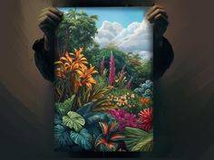 a person holding up a painting in front of their face with the image of tropical plants and flowers painted on it