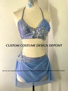 a mannequin wearing a blue dress with sequins on the top and bottom