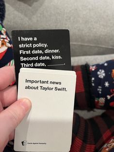 someone is holding up a card that says important news about taylor swift on it