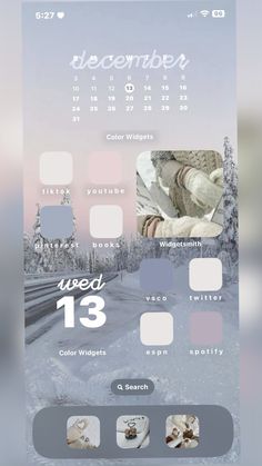 an iphone screen showing the calendar for december, with snow and trees in the background