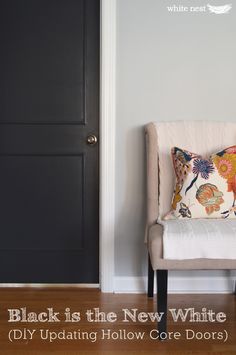 a chair sitting in front of a black door with the words black is the new white diy updating hollow core doors