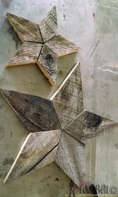 three wooden stars are shown on the wall