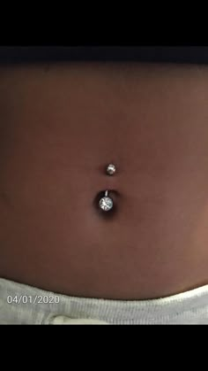 a woman's stomach with two diamonds on it