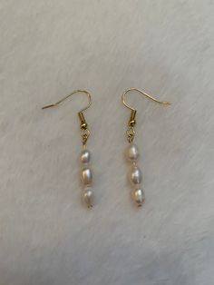 Nickel free pearl and gold earrings that are lightweight and fun to wear with almost anything! Gold Dangle Pearl Earrings, Pearl White Dangle Earrings For Everyday, Gold Linear Earrings With Pearl Drop For Everyday, Everyday Gold Earrings With Pearl Chain, Single Dangle Pearl Earring In 14k Gold Filled, Gold Minimalist Beaded Earrings, Gold Pearl Linear Earrings With Matching Pair, Gold Beaded Earrings With Pearl Drop For Gifts, Gold Dangle Beaded Earrings With Pearl Drop