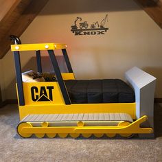 a bed made to look like a construction vehicle