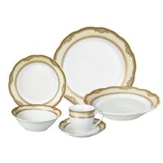 a white and gold dinner set