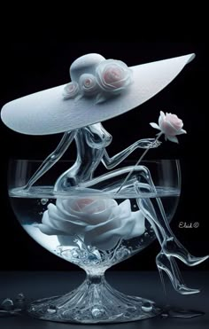 a woman in a white hat sitting on top of a glass bowl