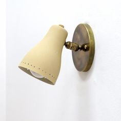 Pair of fabulous French wall lights, 1950, in brass with ivory color, perforated shades, fully adjustable, wired for US standards, one E12 socket per light, max. wattage 60w each or LED equivalent, bulbs provided as a onetime courtesy. Fish Shop, Shop Space, French Walls, Ivory Color, Wall Lights, Shades, Fish, Brass, Led