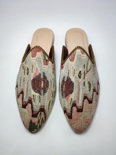 Welcome to AliDesignStore This Kilim Mules one -of-A-kind! Upper Made of a Hand-Selected Vintage Turkish Kilim Rug . Kilims Rugs Are Hand Crafted From Vegetable Yarn. Have Stronger weave. - Handcrafted - Materials : Handwoven Kilim Rug Leather Sole Leather Trimmed Leather Lining Stacked Leather Sole Rubber Under The Stacked Heel Care: Soft Clothing Brush İs Recommended To Clean The Slipper. İf Something Spill on it.You Can Clean İt a Cloth With shampoo. - Ships from a small business in Turkey Heel Care, Soft Clothing, Clogs And Mules, Vintage Turkish Kilim Rug, Slides Women, Soft Clothes, Handwoven Kilim, Clogs Shoes, Turkish Kilim Rugs