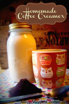 a jar of coffee creamer next to an owl mug