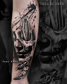 a man's arm with tattoos on it and a skull in the middle of his arm