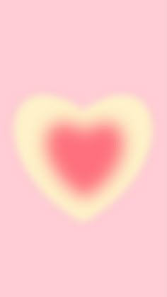 a heart shaped object is shown against a pink background with white and yellow highlights on it