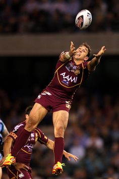 a man jumping up to catch a soccer ball