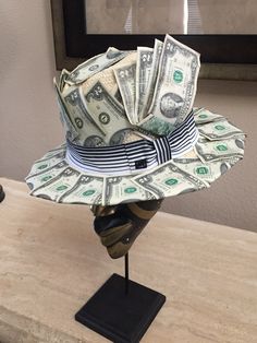 a hat made out of money sitting on top of a table