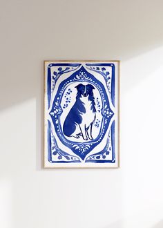 a blue and white tile with a dog sitting on it's side in a corner