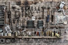 there are many tools hanging on the wall