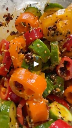 a close up of a plate of food with peppers and other vegetables on it,