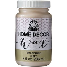 a jar of white paint with the words home decor wax on it