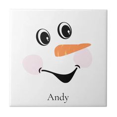 a ceramic tile with an image of a snowman's face and the words andy on it