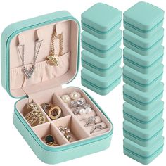 a blue case filled with lots of jewelry