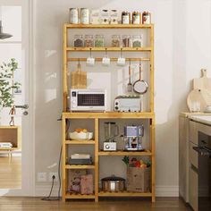 a kitchen area with a microwave, toaster and other items on a shelf in front of the door