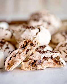 chocolate chip cookies and marshmallows are stacked on top of each other