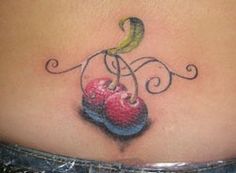 a woman's stomach with a small tattoo on her belly and an apple in the center