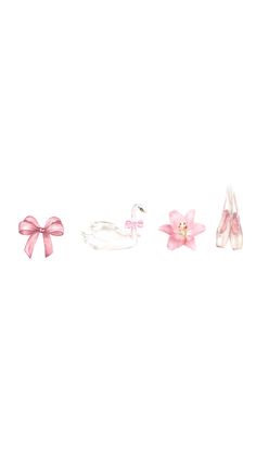 three pairs of shoes with pink bows on the bottom, and one pair in white