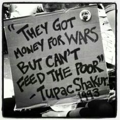 a woman sitting on the ground holding a sign that says they got money for wars but can't feed the poor