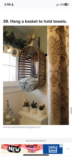 the bathroom is decorated for christmas and has a hanging basket on the wall above the toilet