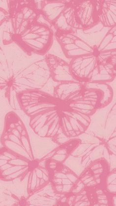 pink butterflies are flying in the air