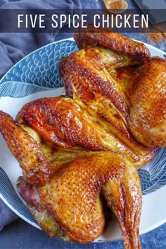 two pieces of cooked chicken on a blue and white plate