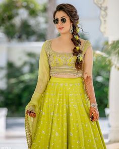 a woman in a green lehenga