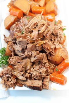 a white plate topped with meat and veggies