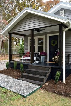 a porch with steps leading to the front door