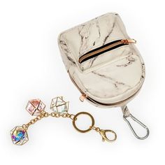 Wherever she goes wandering, her Claire's Spunky Keychain Bundle is sure to follow! Featuring 1 miniature marble backpack keychain and 1 rose gold-tone crystal keychain. Adorned with a rose gold-tone details and a minimalist marble print, this backpack has zip compartment. Personalize belongings by clipping the metal keyring to purse rings, backpack zippers, keys, makeup bags and more. Its Off-White in color. Suitable for ages 3 and up. Size: one size.  Gender: unisex.  Age Group: kids. Gingerbread Craft, Living Room Cream, Diy Crafts Keychain, Friendship Keychain, Wine Holders, Keychain Bundle, Counter Height Pub Table, Koala Plush, Dinette Table