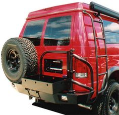 a red pick up truck parked on the side of a road