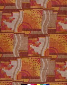 an orange, yellow and brown pattern on fabric